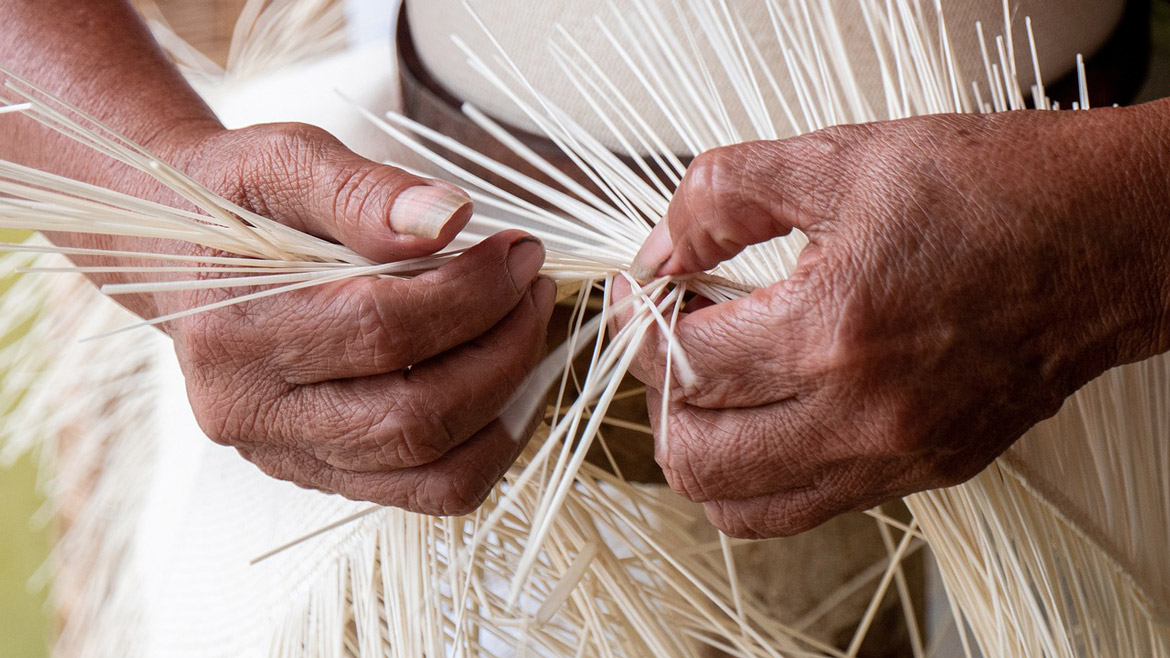 working hands creating a hats